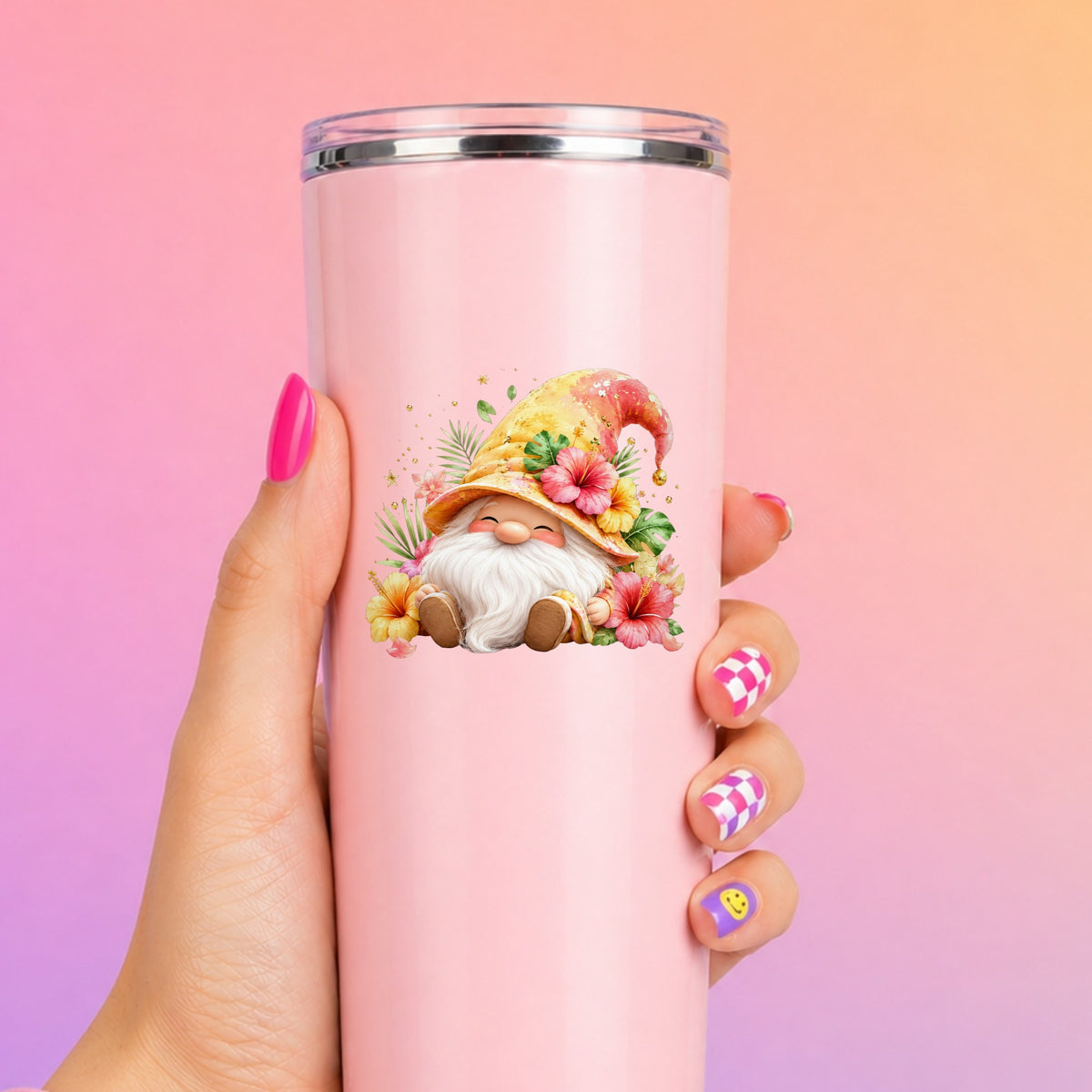 Tropical Hibiscus Gnome UV DTF sticker applied to a tall pink tumbler on a pink and orange background
