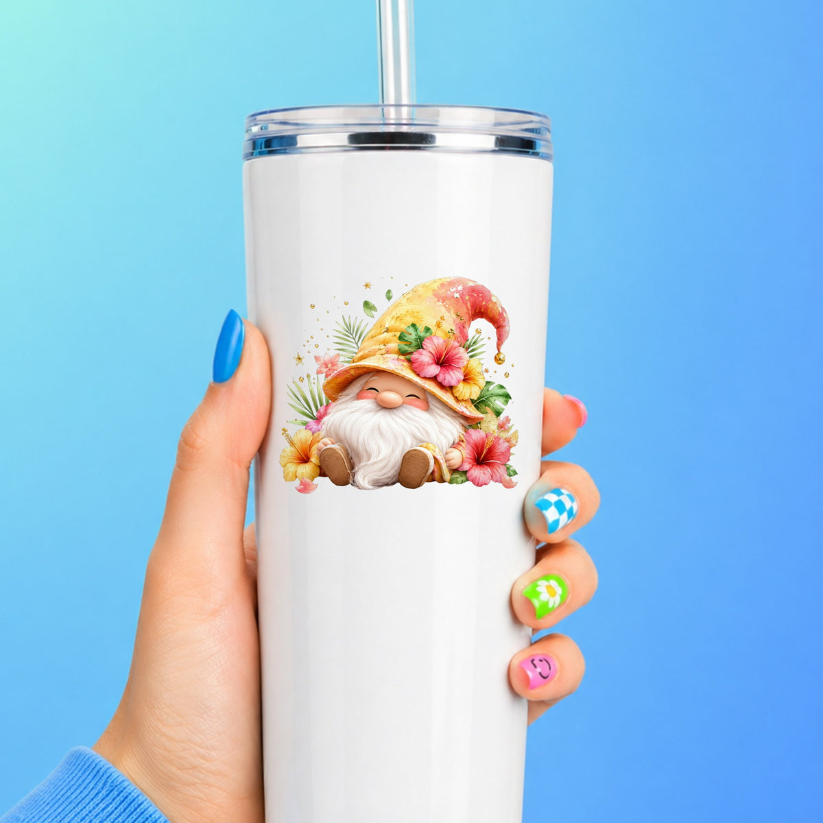 Tropical Hibiscus Gnome UV DTF sticker applied to a white straw tumbler on a blue background