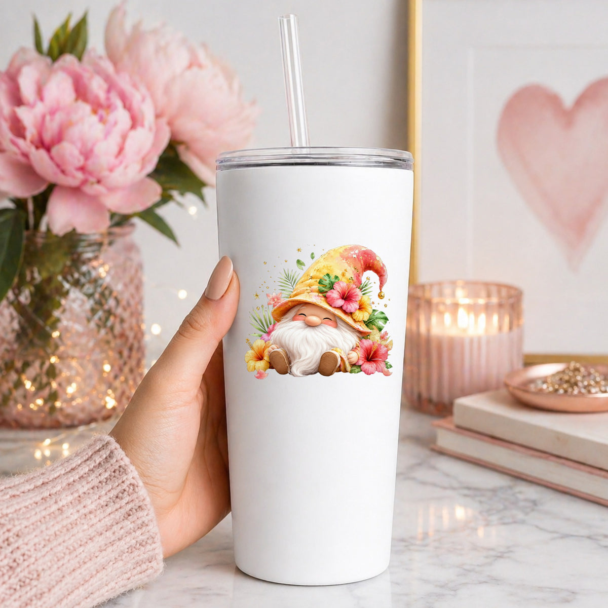 Tropical Hibiscus Gnome UV DTF sticker applied to a white straw tumbler beside pink peonies