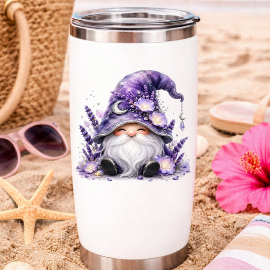 Lavender Gnome With Moon Charm UV DTF sticker applied to a white travel tumbler on beach sand