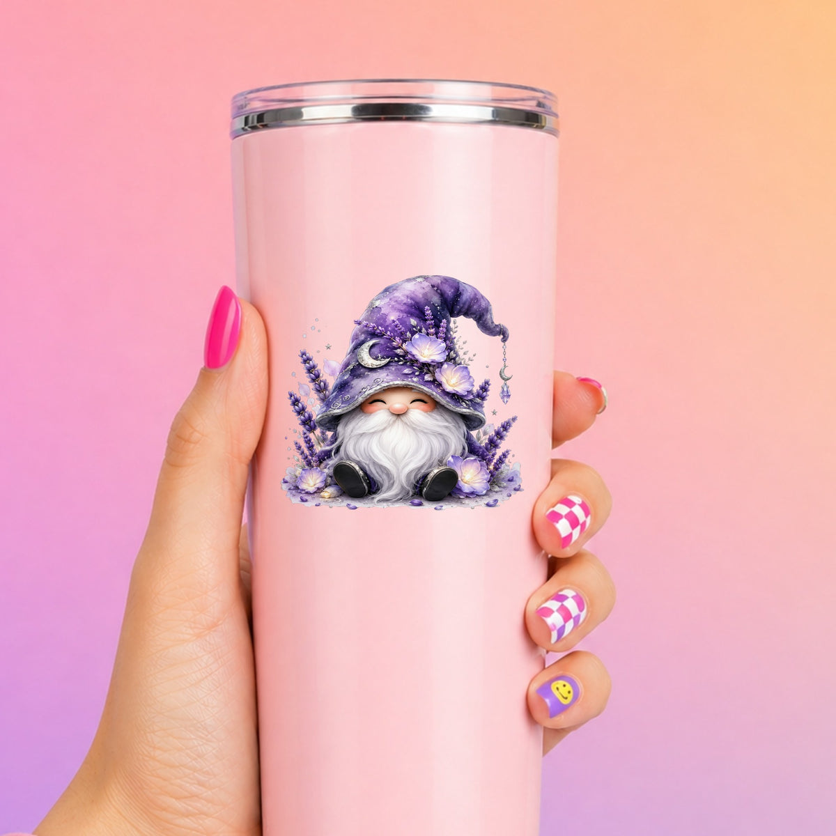 Lavender Gnome With Moon Charm UV DTF sticker applied to a tall pink tumbler on a pink and orange background