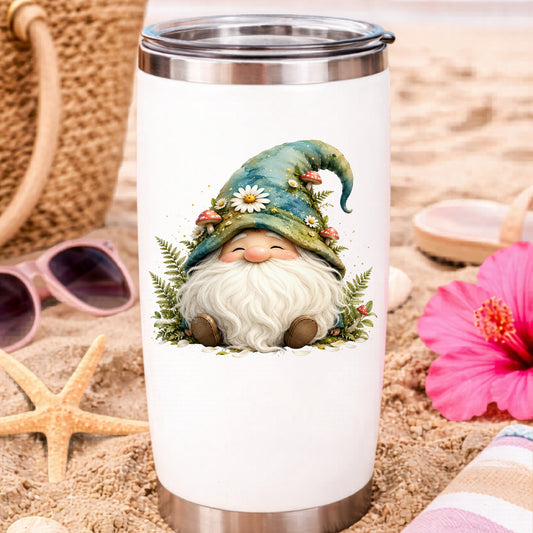 Toadstool Mushroom Gnome UV DTF sticker applied to a white travel tumbler on beach sand