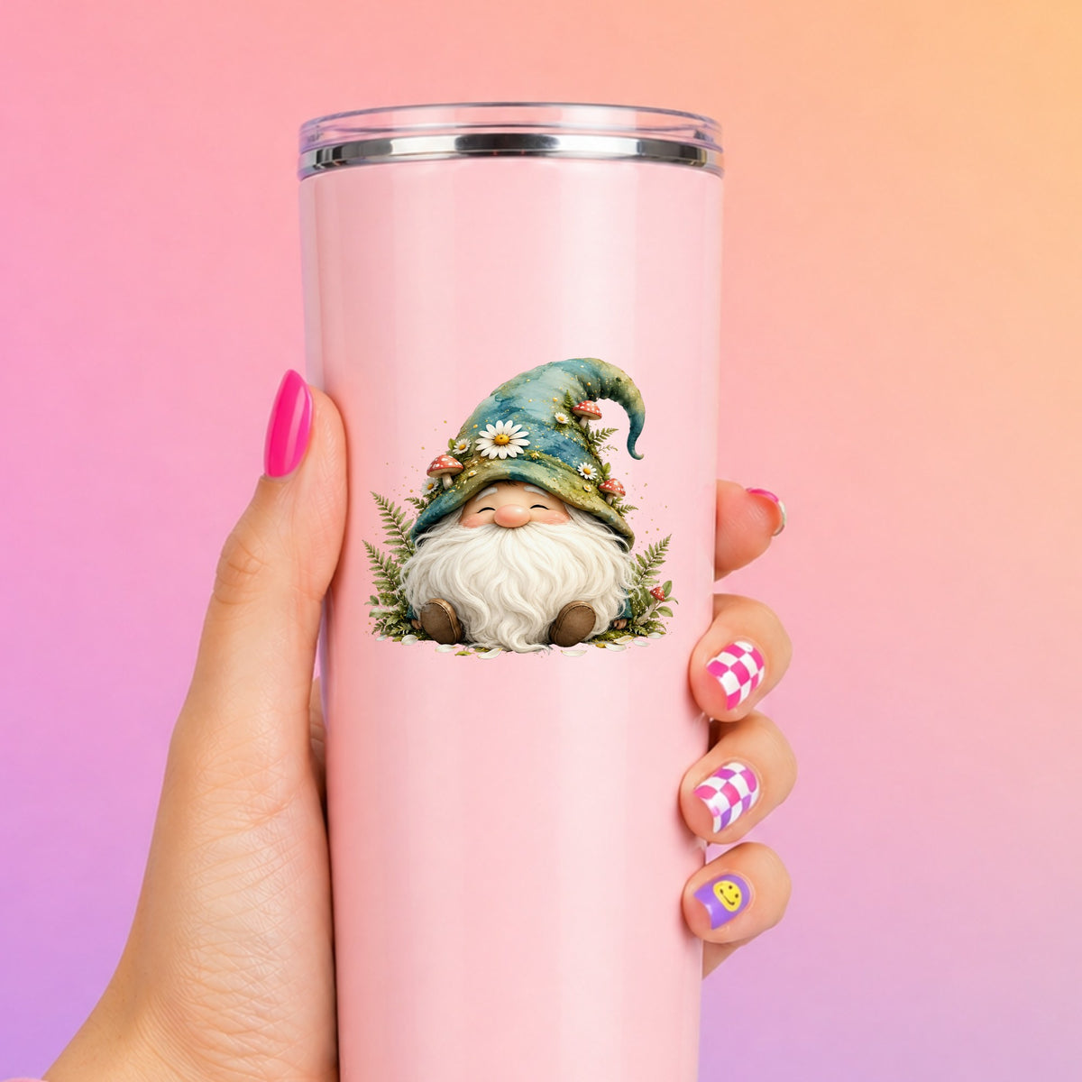 Toadstool Mushroom Gnome UV DTF sticker applied to a tall pink tumbler on a pink and orange background