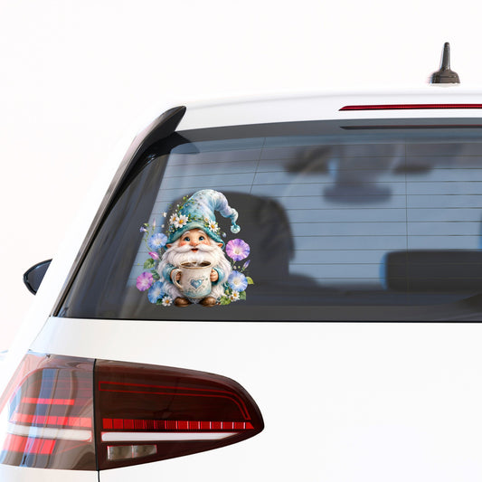 Gnome Holding Coffee Mug UV DTF sticker applied to the rear window of a white car