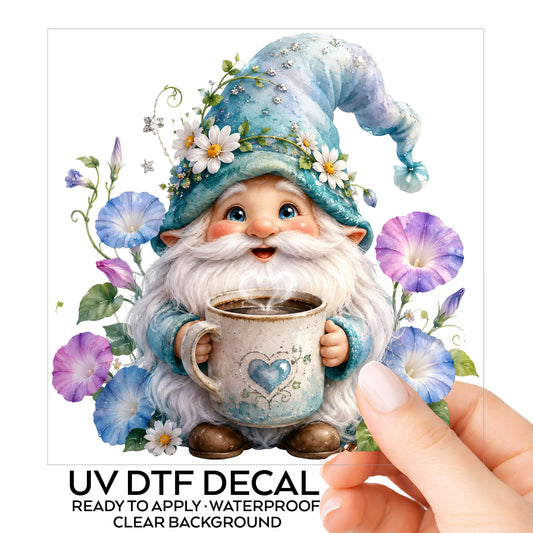 Gnome Holding Coffee Mug UV DTF sticker on its backing card, held in hand