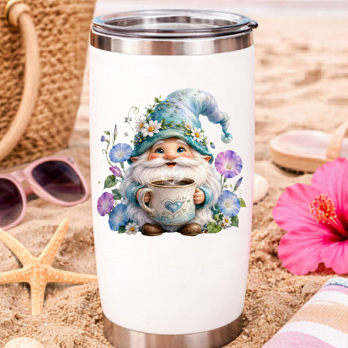 Gnome Holding Coffee Mug UV DTF sticker applied to a white travel tumbler on beach sand