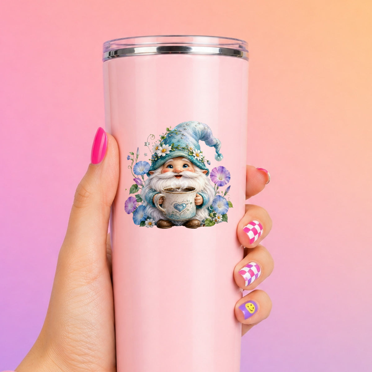 Gnome Holding Coffee Mug UV DTF sticker applied to a tall pink tumbler on a pink and orange background