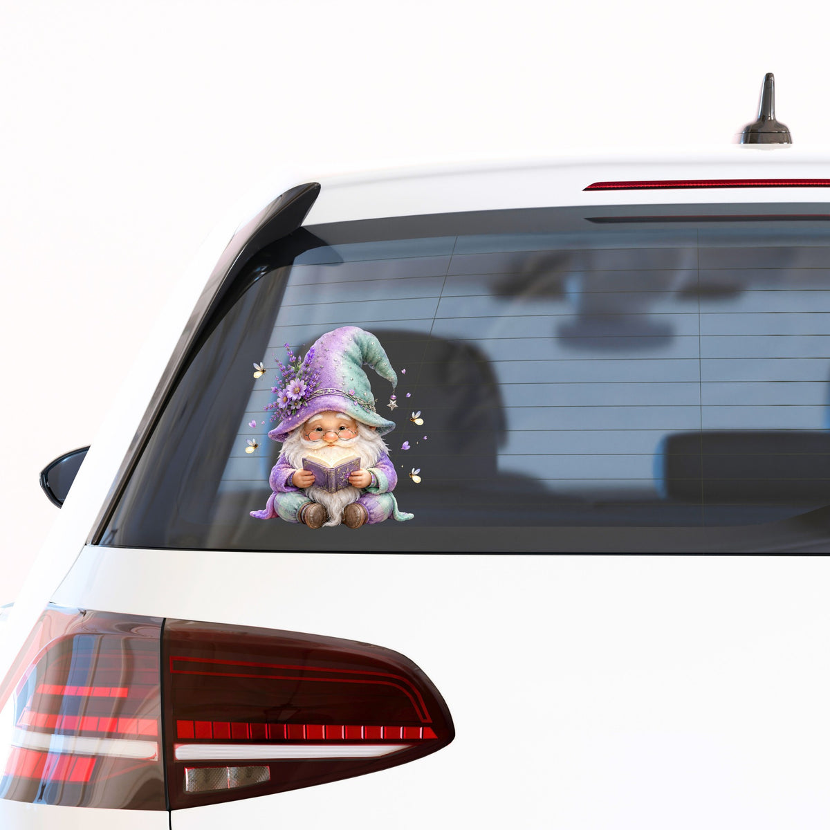 Lavender Reading Gnome With Fireflies UV DTF sticker applied to the rear window of a white car