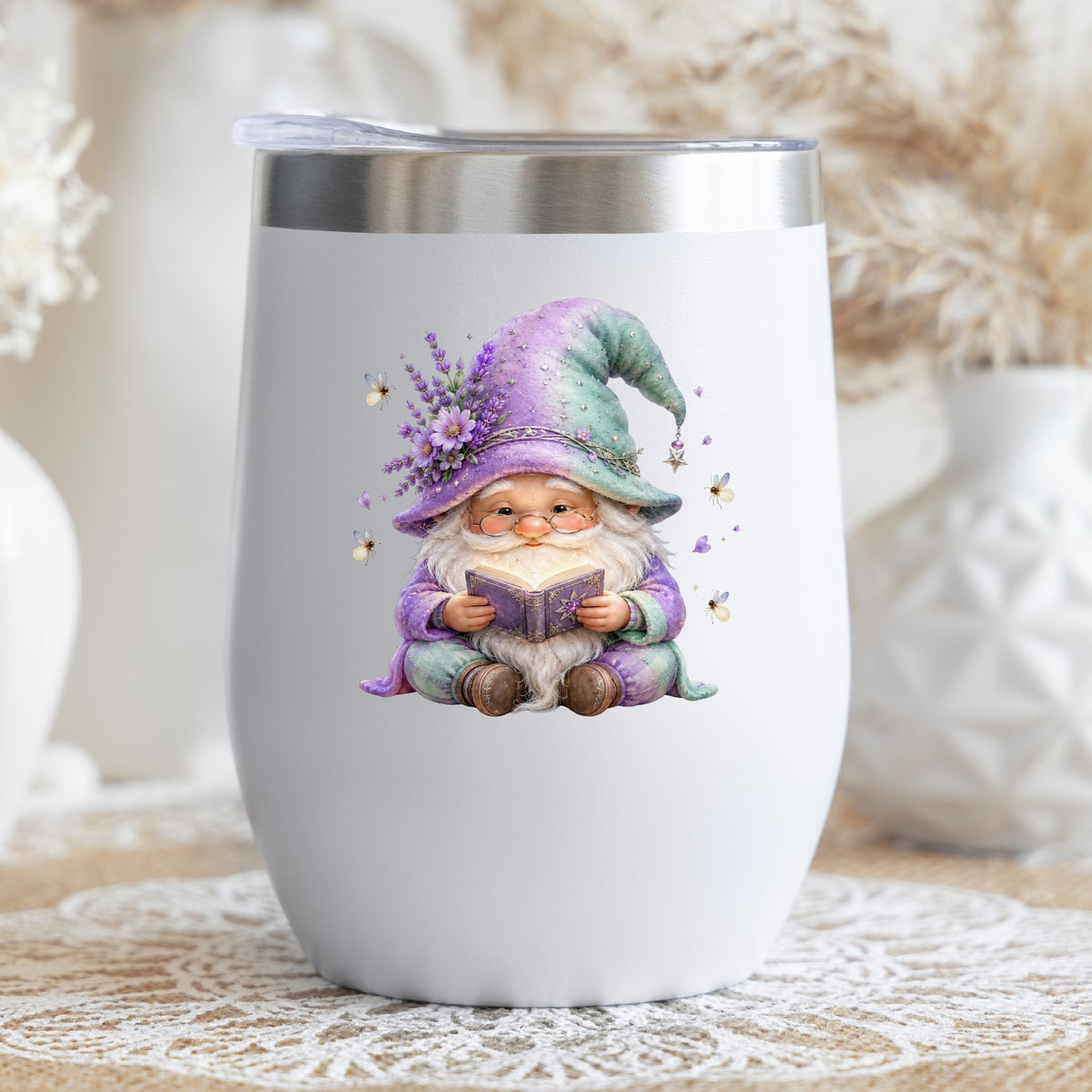 Lavender Reading Gnome With Fireflies UV DTF sticker applied to a white stemless tumbler with a lid
