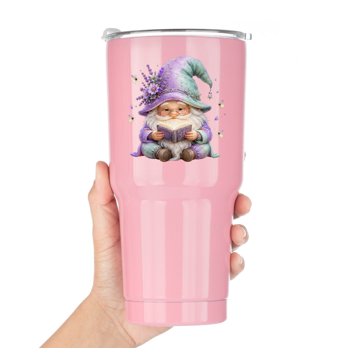 Lavender Reading Gnome With Fireflies UV DTF sticker applied to a pink tumbler held against a white background