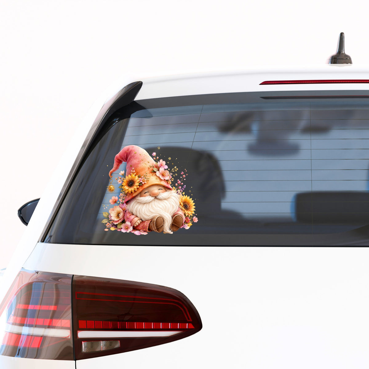 Sunflower Gnome With Pink Flowers UV DTF sticker applied to the rear window of a white car
