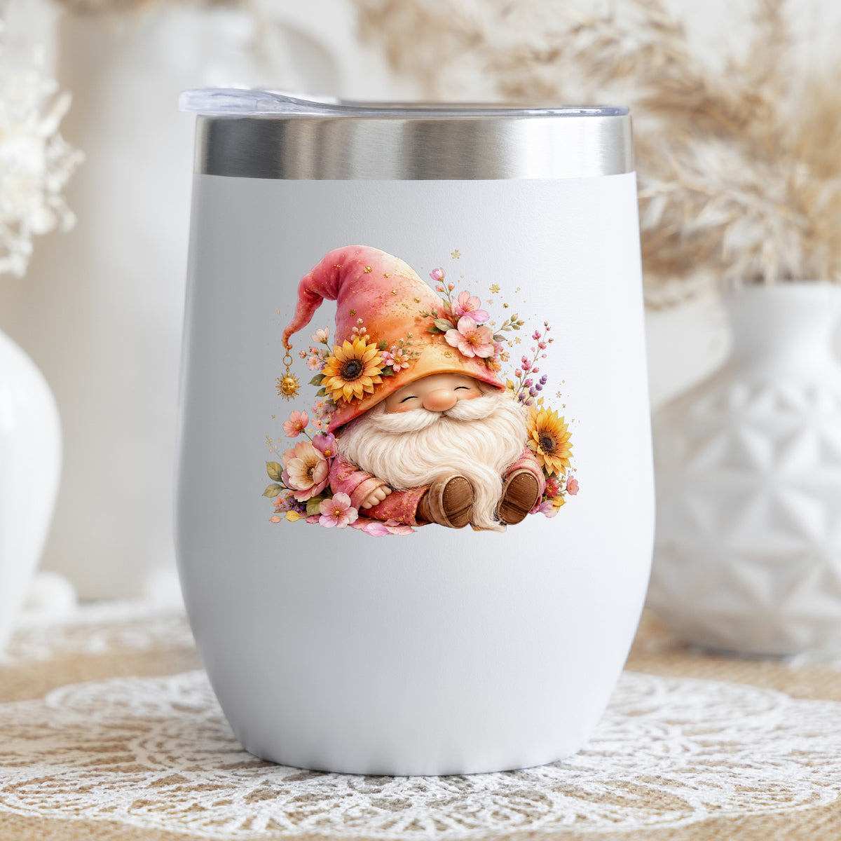 Sunflower Gnome With Pink Flowers UV DTF sticker applied to a white stemless tumbler with a lid