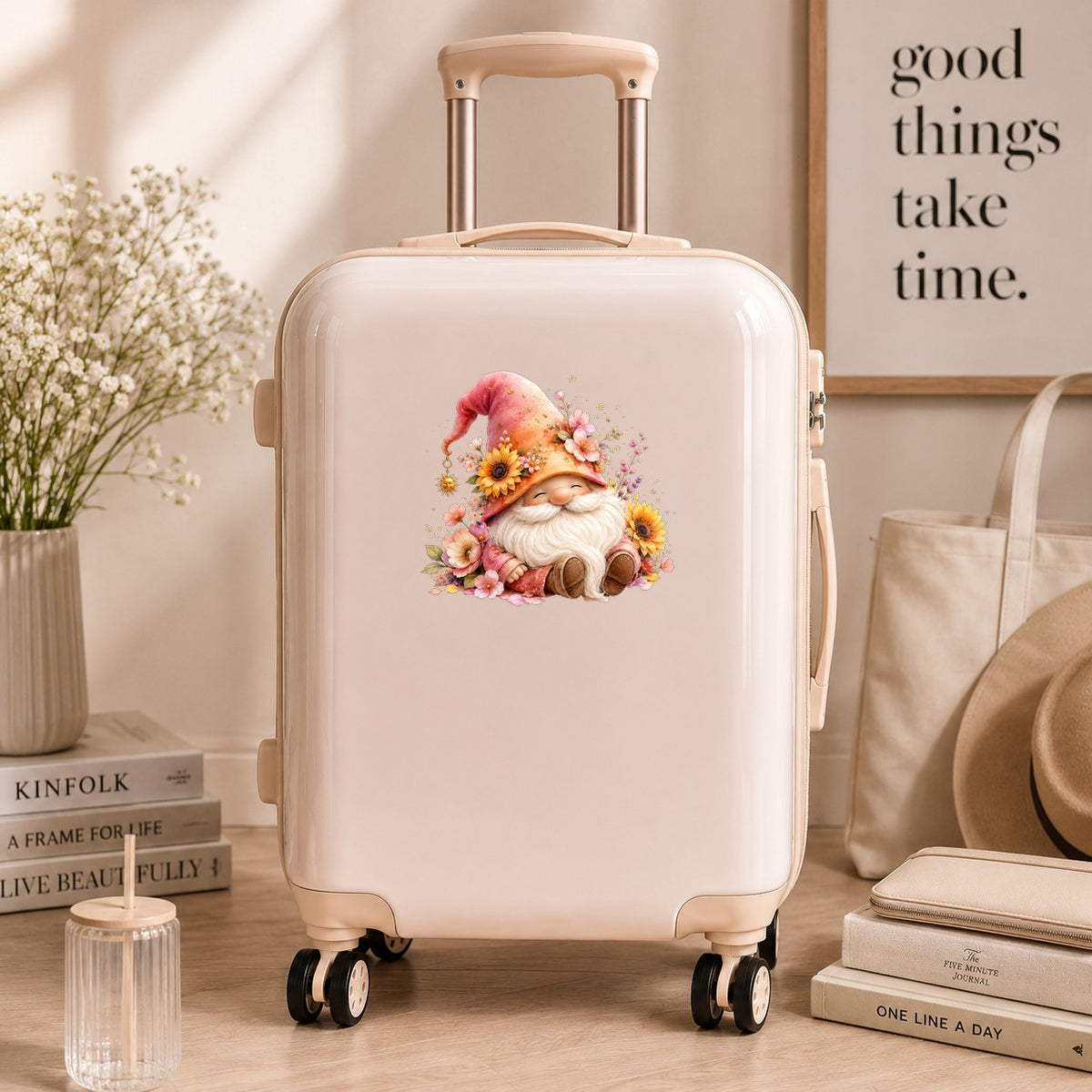 Sunflower Gnome With Pink Flowers UV DTF sticker applied to a cream carry-on suitcase