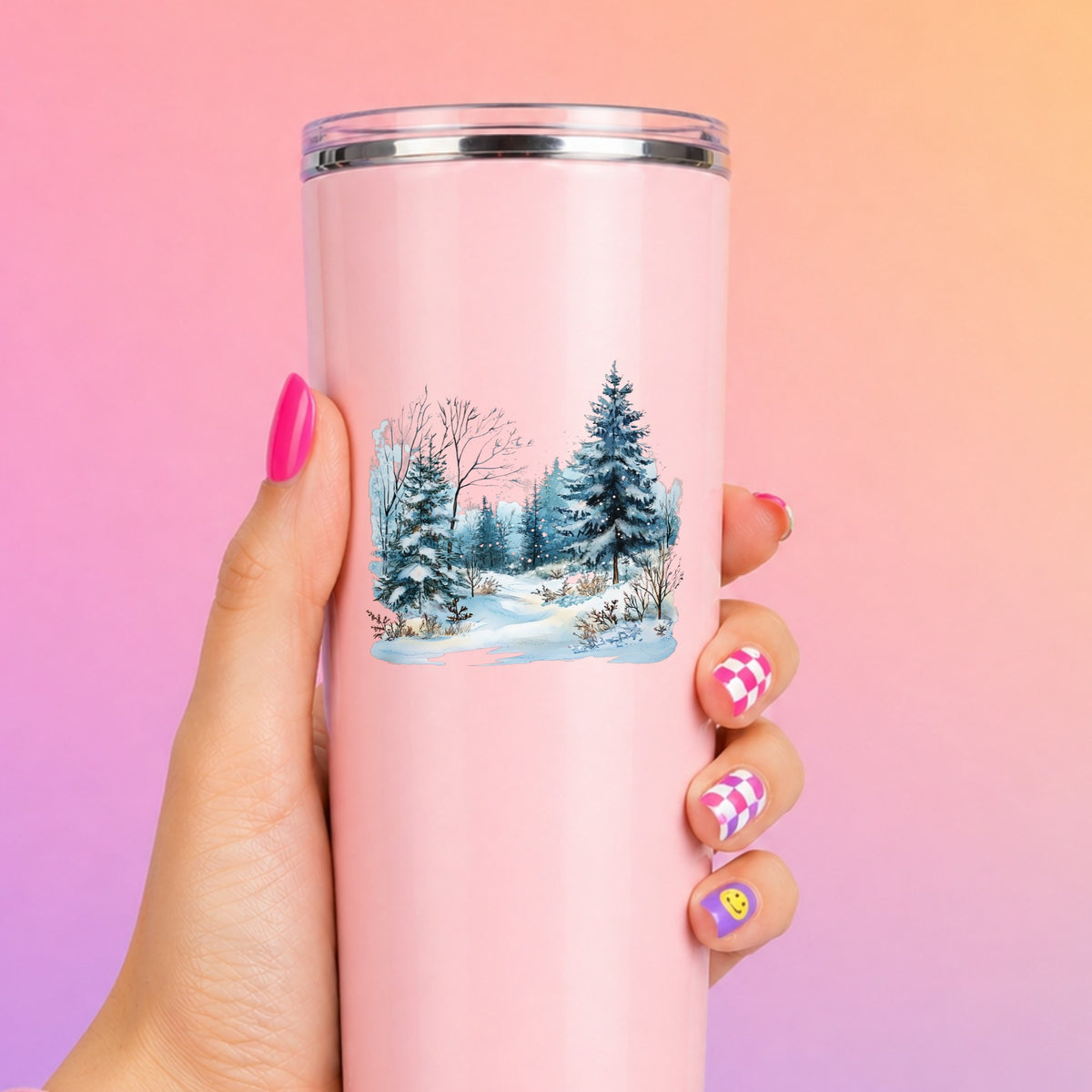 Snowy Pine Forest UV DTF sticker applied to a pink tumbler