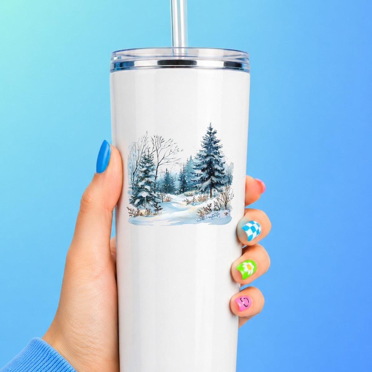 Snowy Pine Forest UV DTF sticker applied to a white tumbler