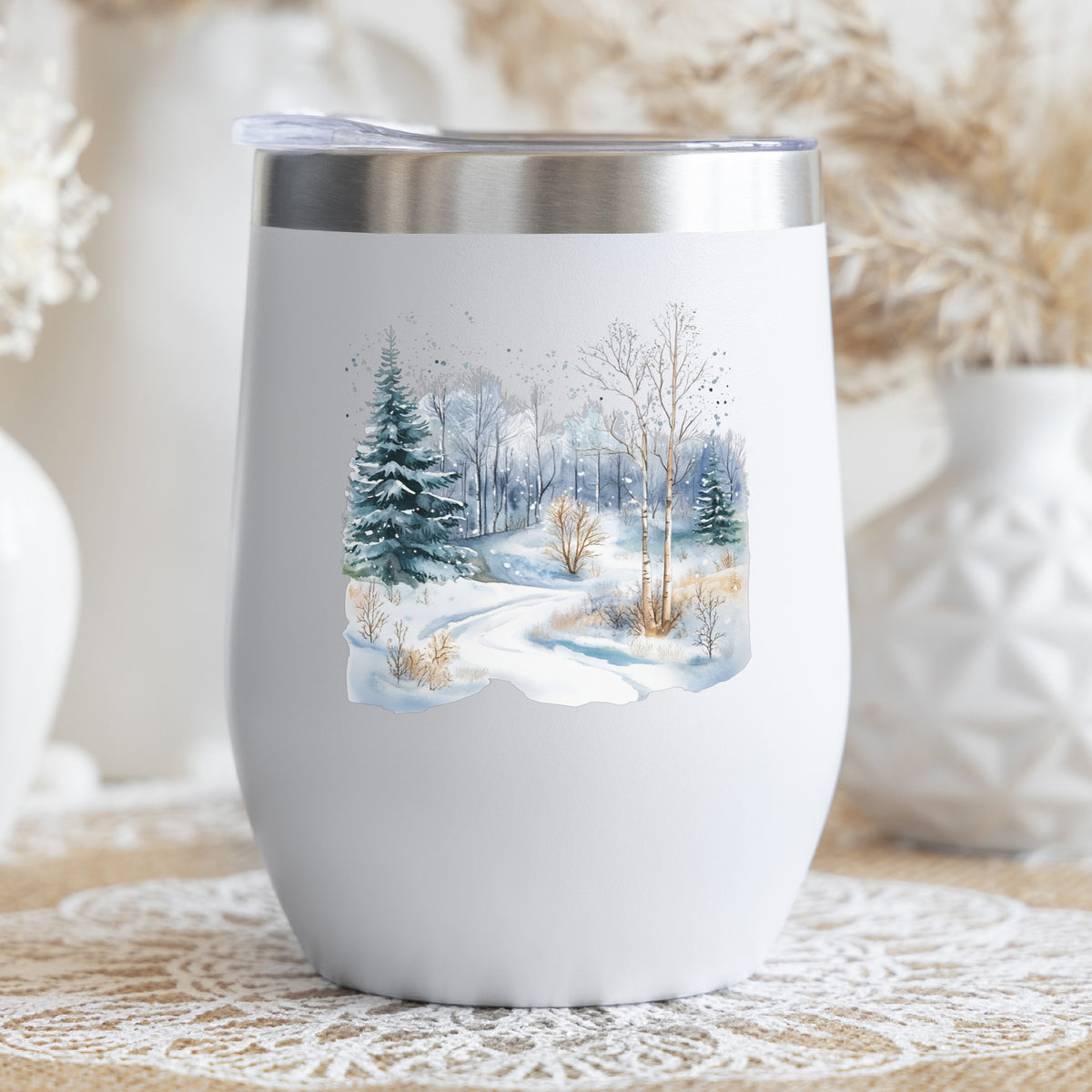 Snowy Forest Path UV DTF sticker applied to a stemless wine glass