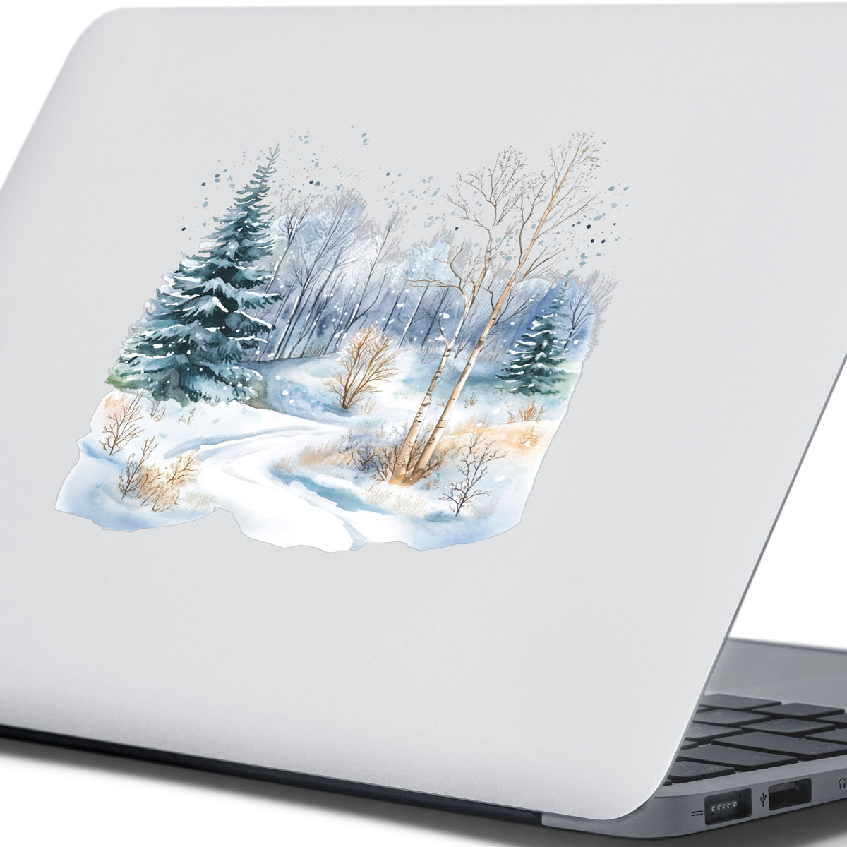 Snowy Forest Path UV DTF sticker applied to a laptop