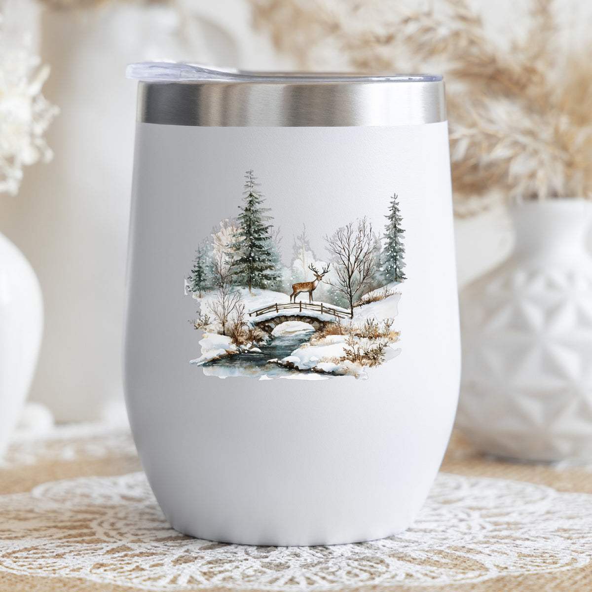 Deer On Stone Bridge UV DTF sticker applied to a stemless wine glass