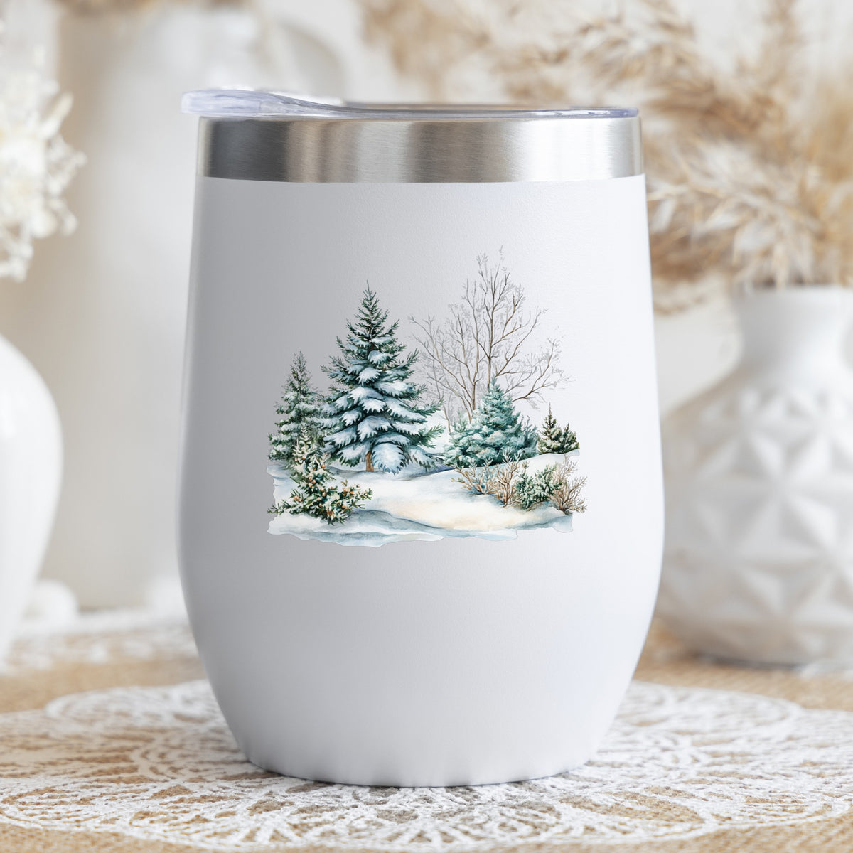 Snow Covered Spruce Trees UV DTF sticker applied to a stemless wine glass