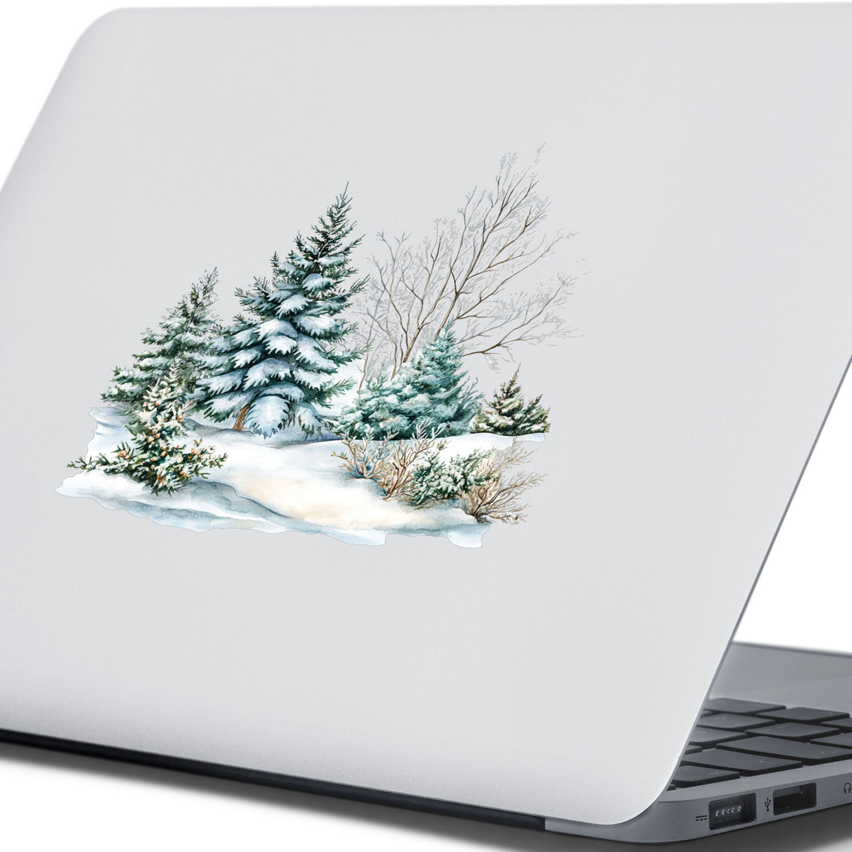 Snow Covered Spruce Trees UV DTF sticker applied to a laptop