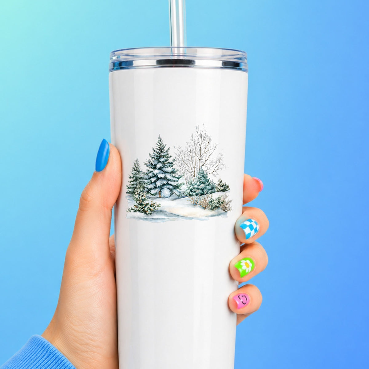 Snow Covered Spruce Trees UV DTF sticker applied to a white tumbler