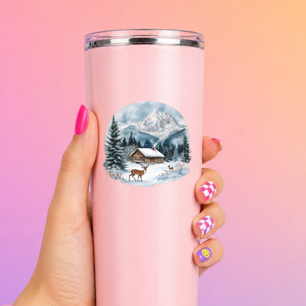 Log Cabin And Deer UV DTF sticker applied to a pink tumbler