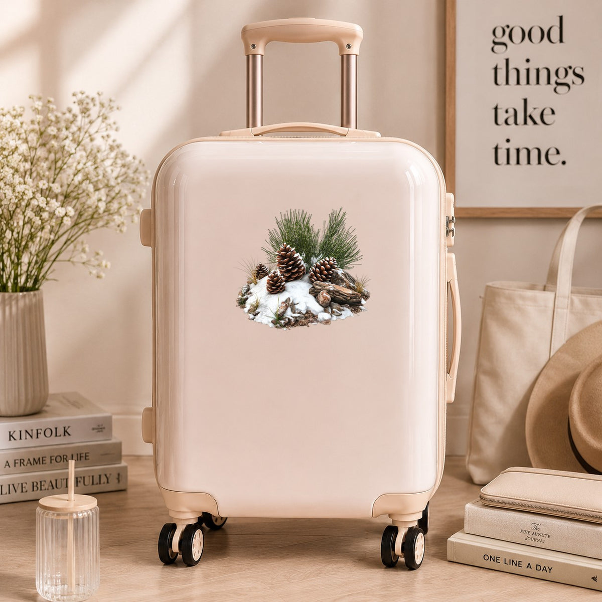 Pine Cones In Snow UV DTF sticker applied to a neutral suitcase