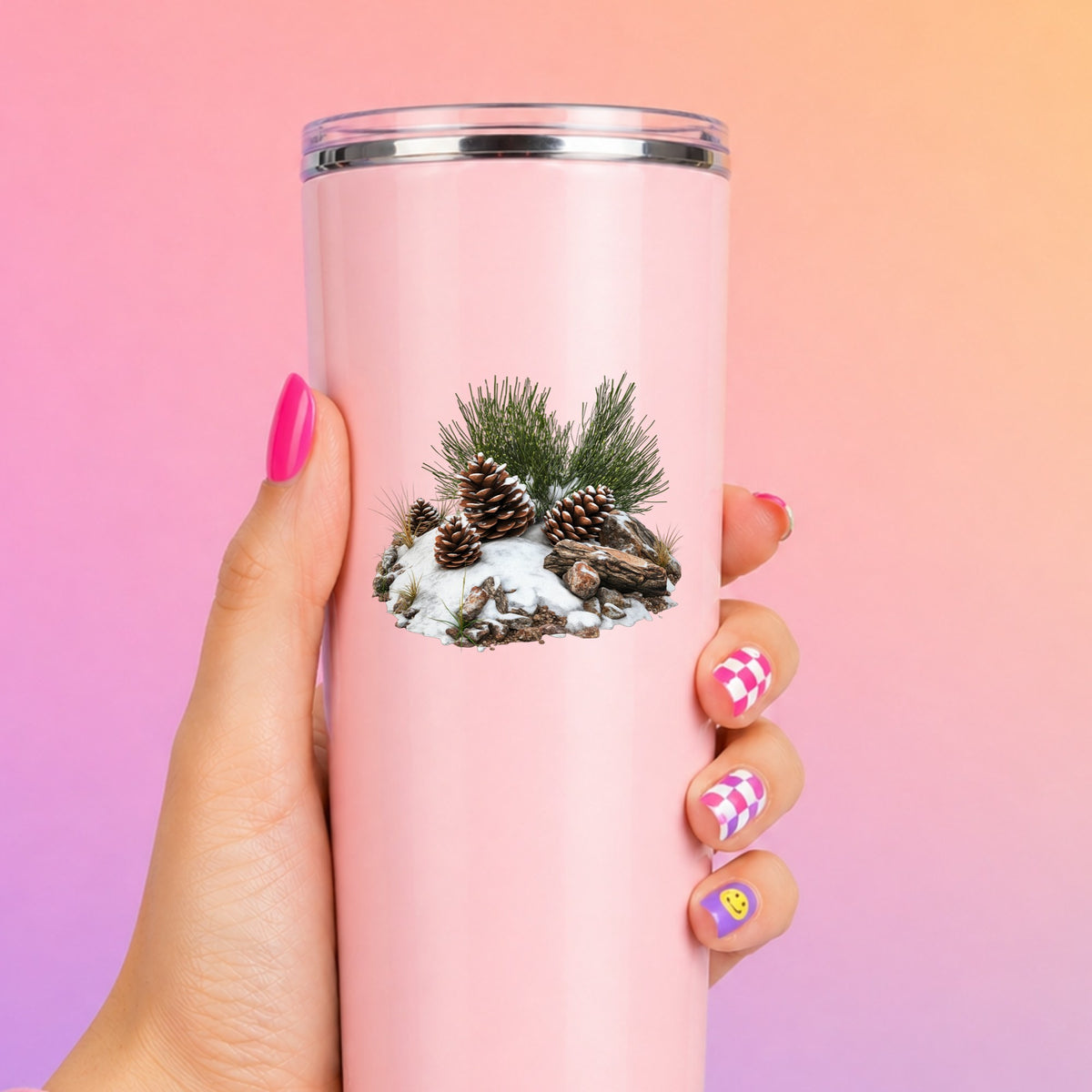 Pine Cones In Snow UV DTF sticker applied to a pink tumbler