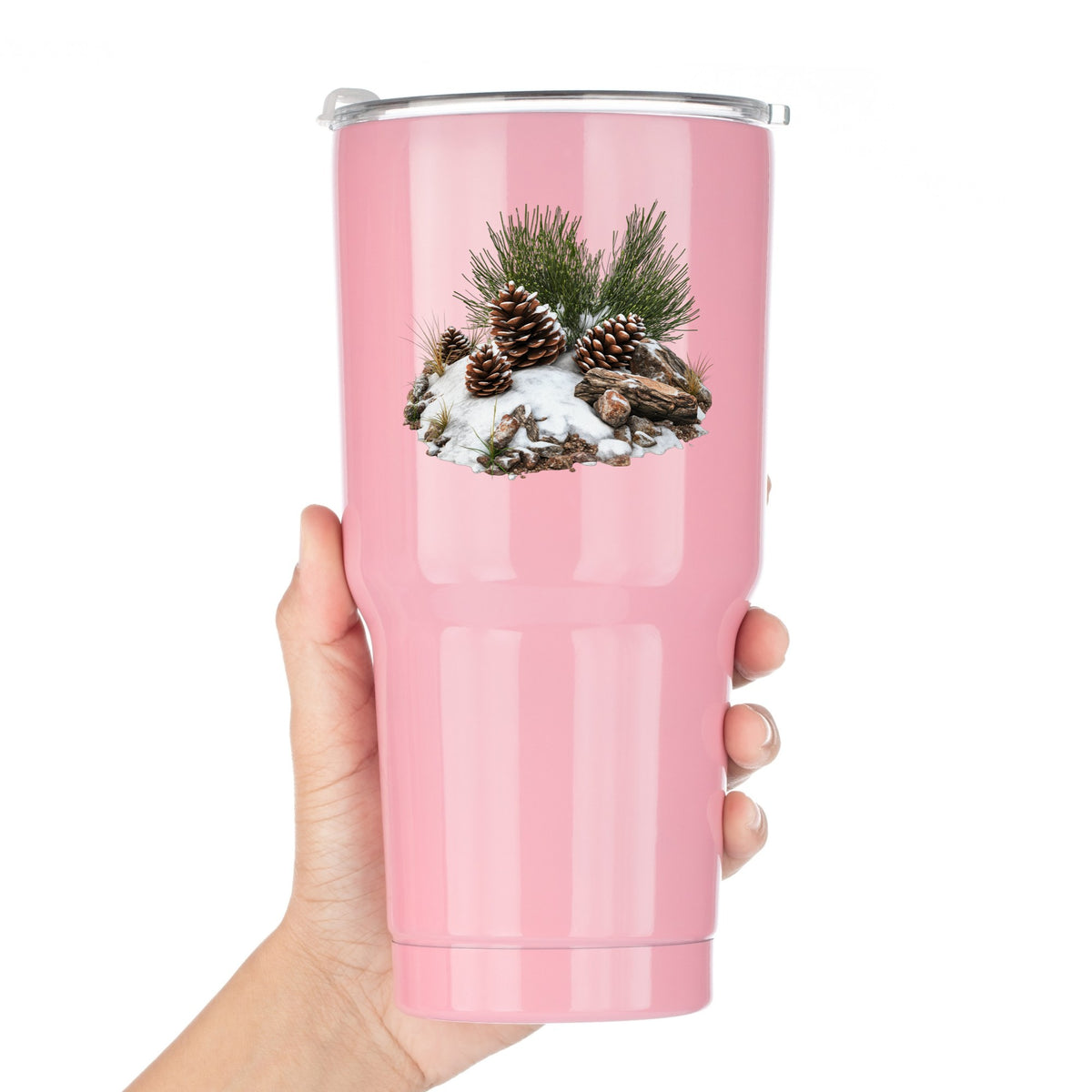 Pine Cones In Snow UV DTF sticker applied to a pink tumbler