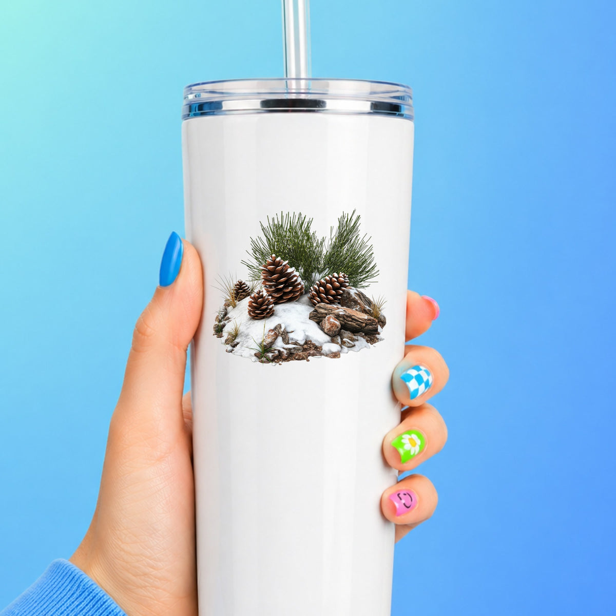 Pine Cones In Snow UV DTF sticker applied to a white tumbler
