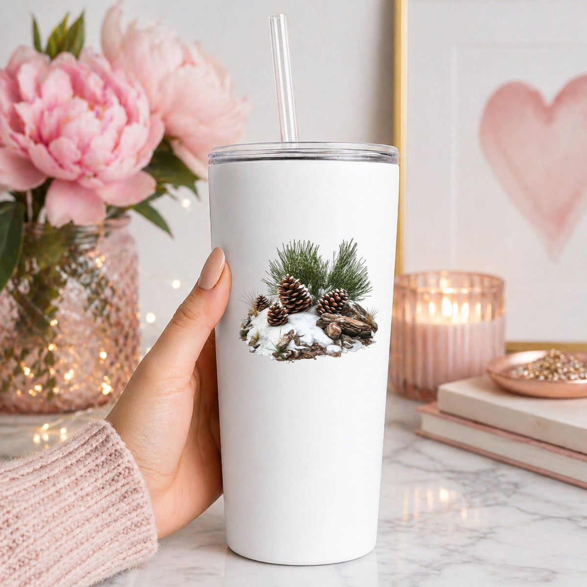 Pine Cones In Snow UV DTF sticker applied to a white tumbler