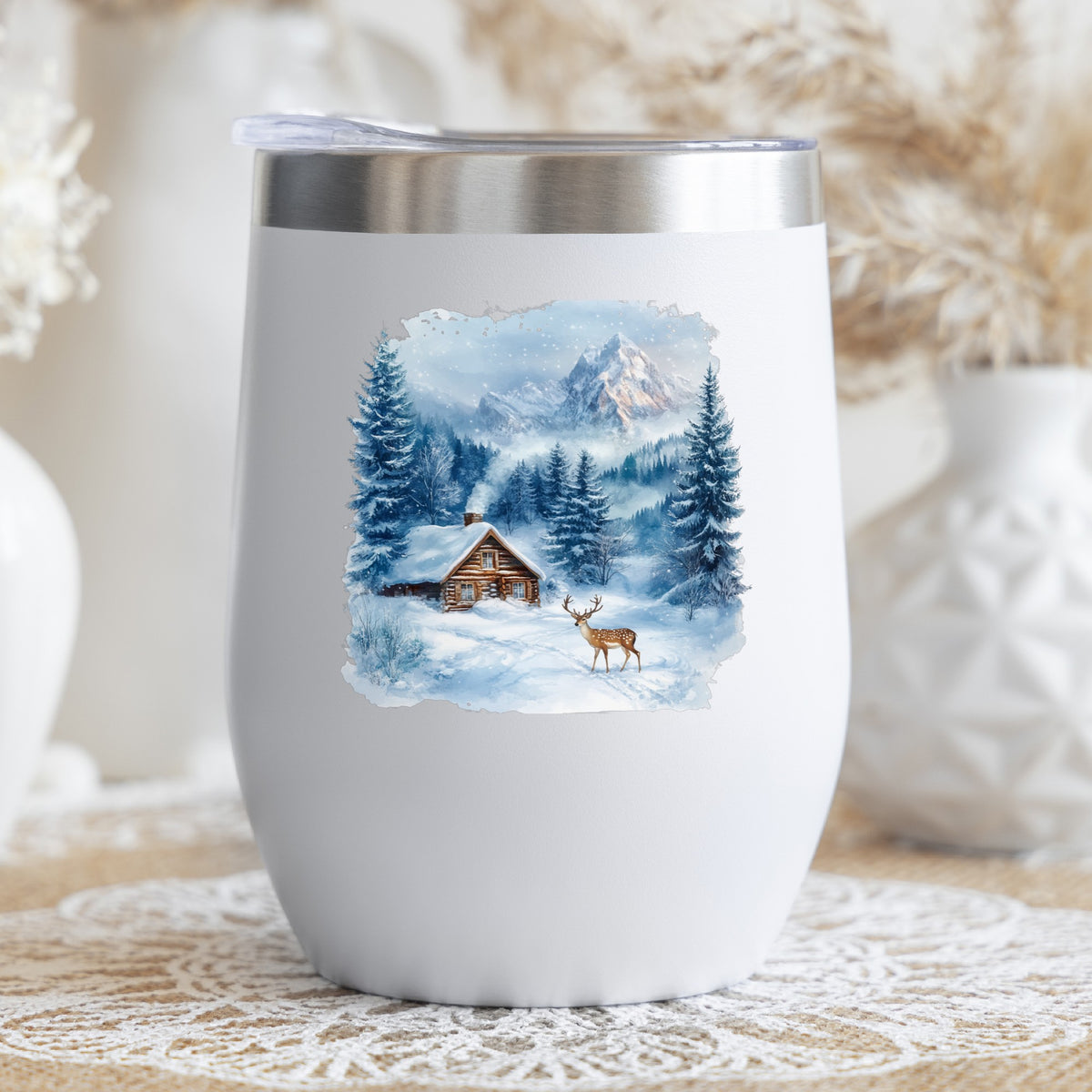 Blue Winter Cabin With Deer UV DTF sticker applied to a stemless wine glass