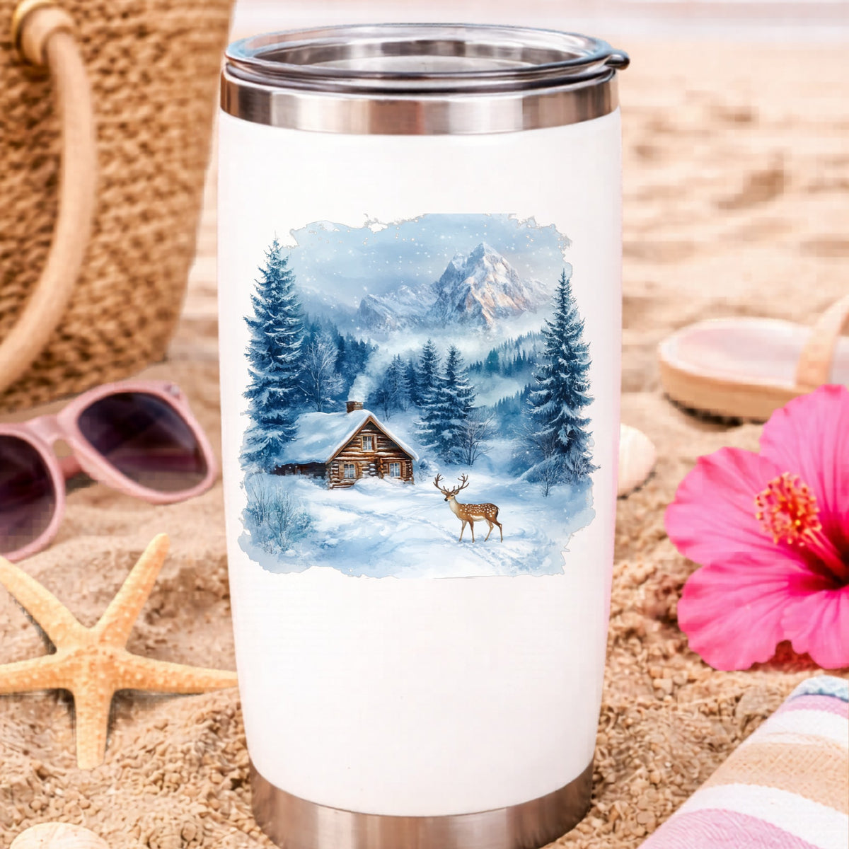 Blue Winter Cabin With Deer UV DTF sticker applied to a water bottle at the beach
