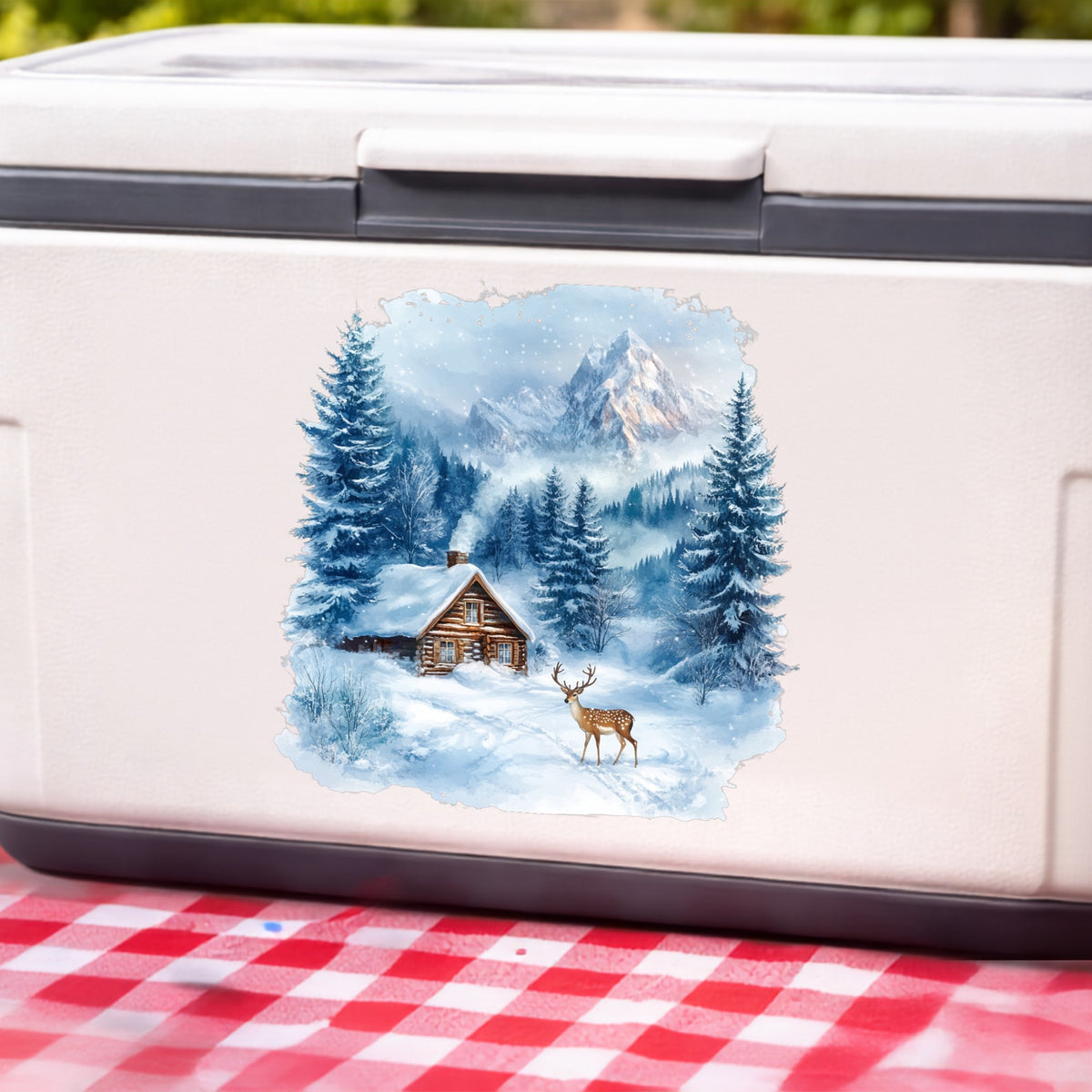 Blue Winter Cabin With Deer UV DTF sticker applied to a white cooler