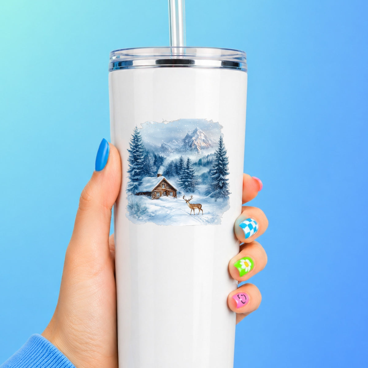 Blue Winter Cabin With Deer UV DTF sticker applied to a white tumbler