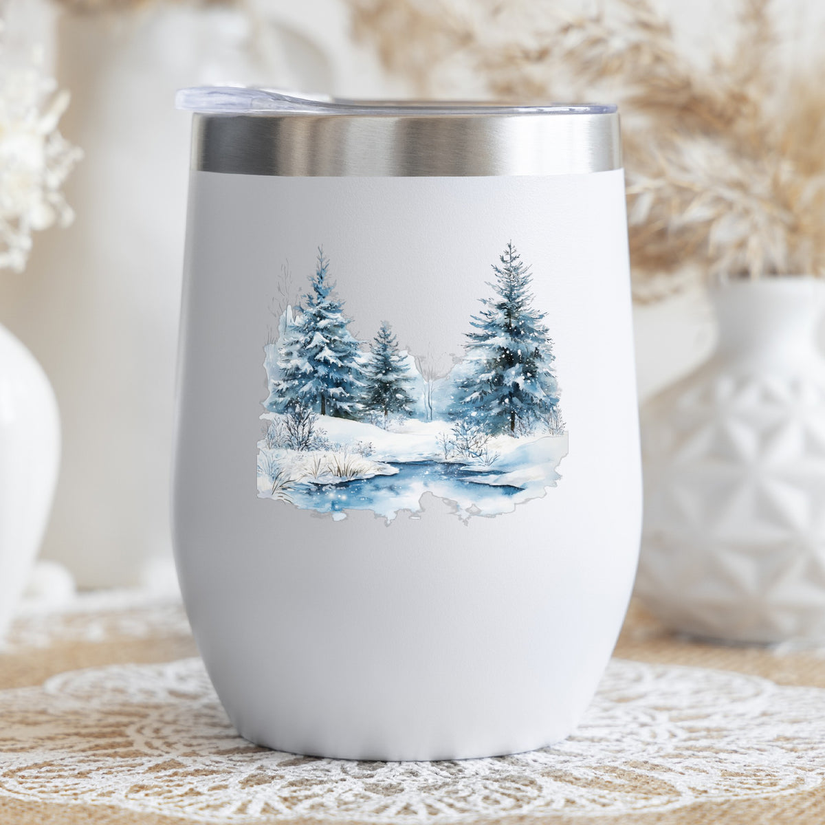 Snowy Evergreens By Stream UV DTF sticker applied to a stemless wine glass