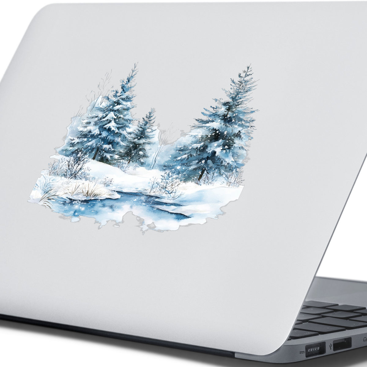 Snowy Evergreens By Stream UV DTF sticker applied to a laptop
