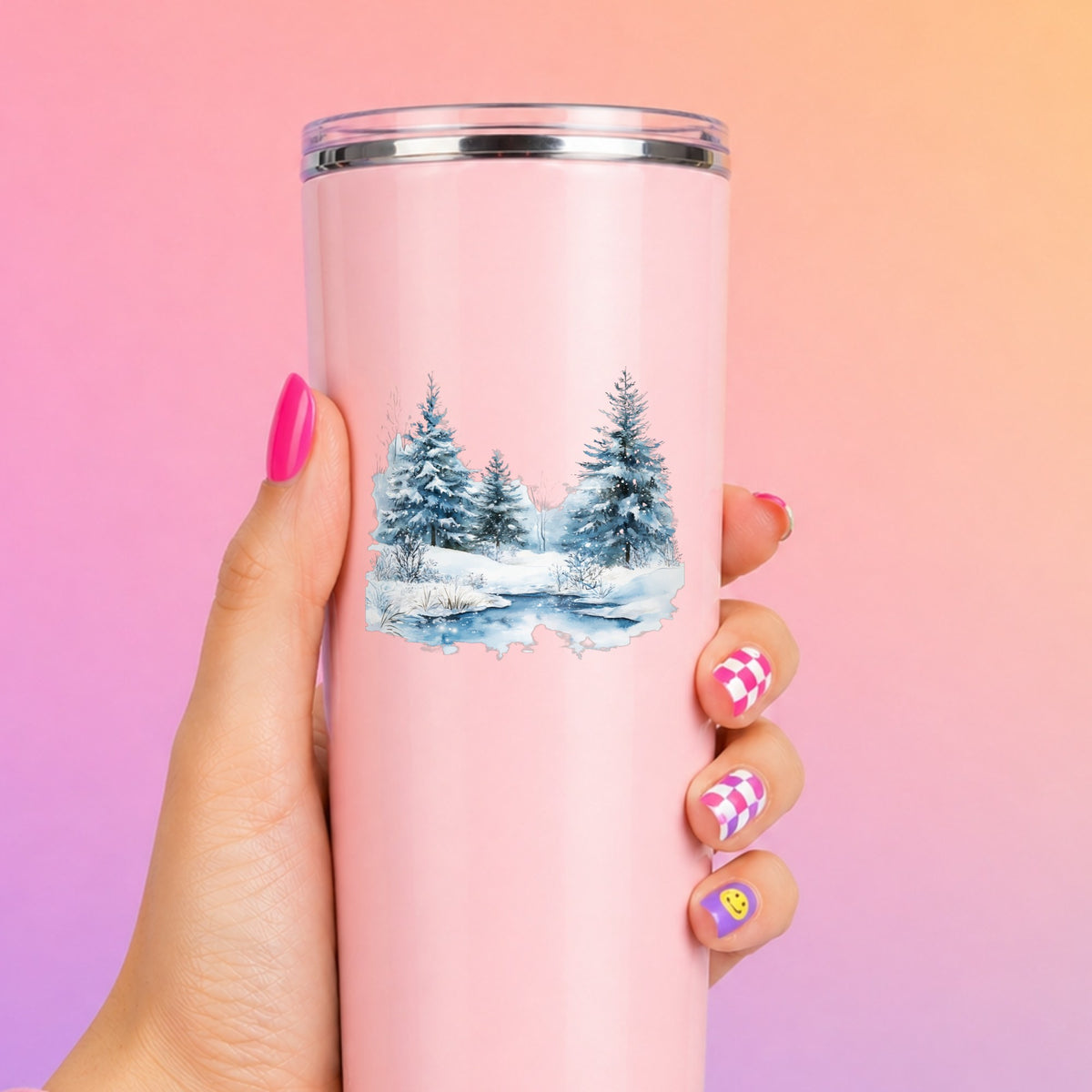 Snowy Evergreens By Stream UV DTF sticker applied to a pink tumbler