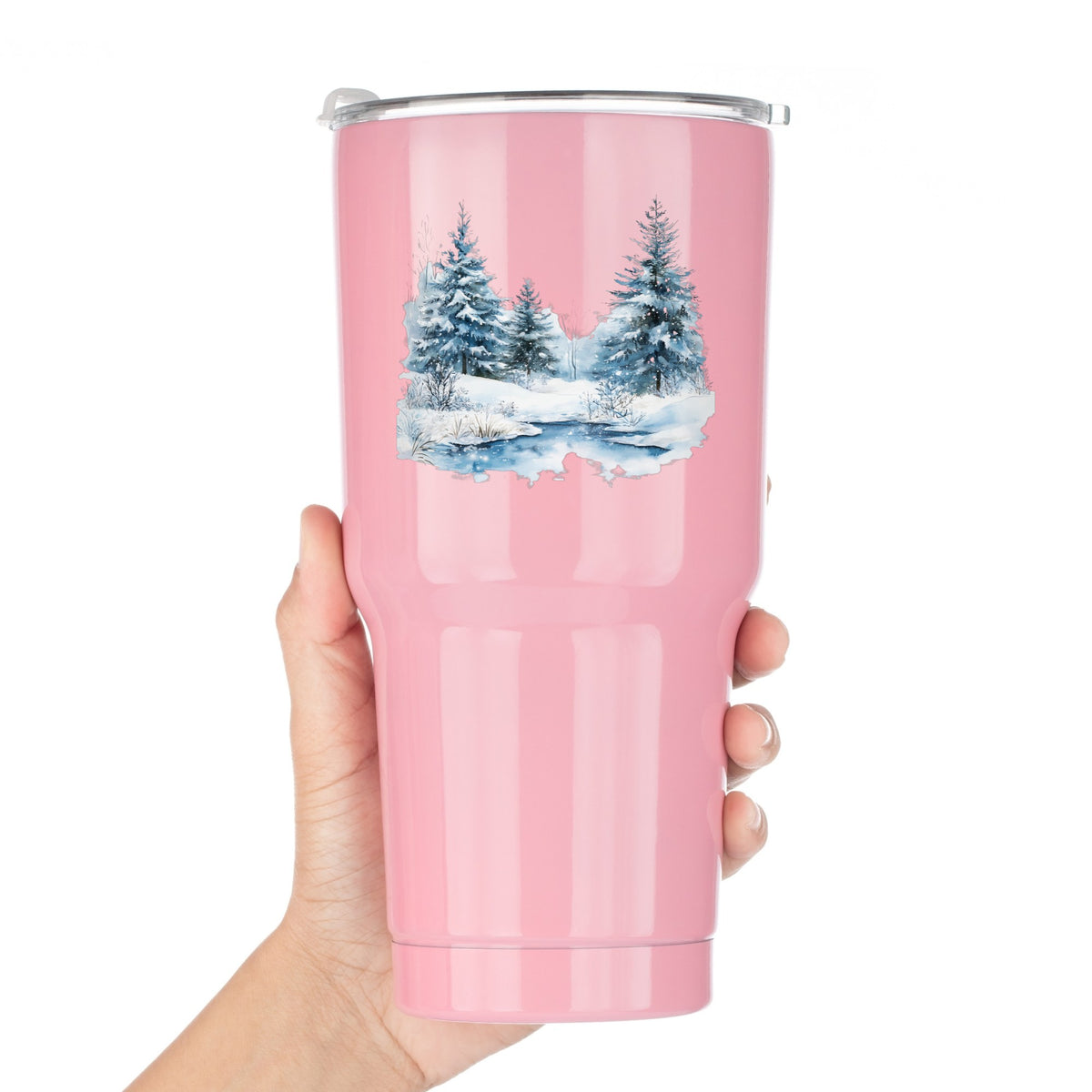 Snowy Evergreens By Stream UV DTF sticker applied to a pink tumbler