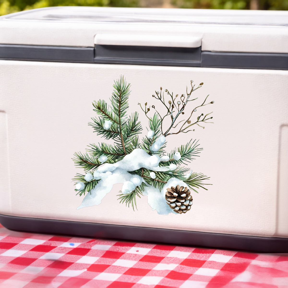 Snowy Pine Branch With Pine Cone UV DTF sticker applied to a white cooler