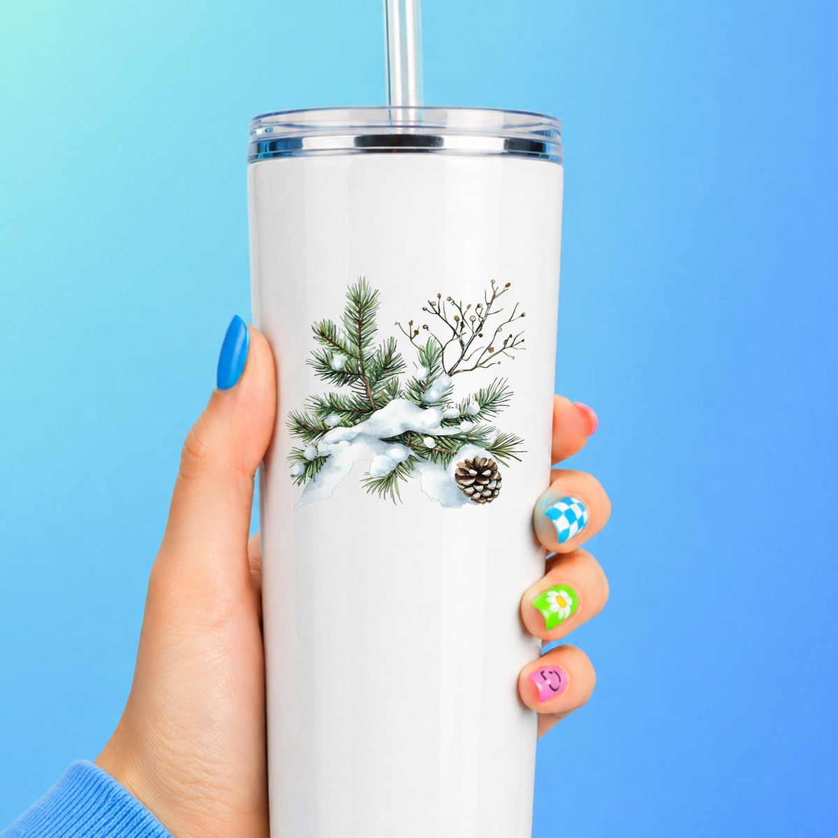 Snowy Pine Branch With Pine Cone UV DTF sticker applied to a white tumbler