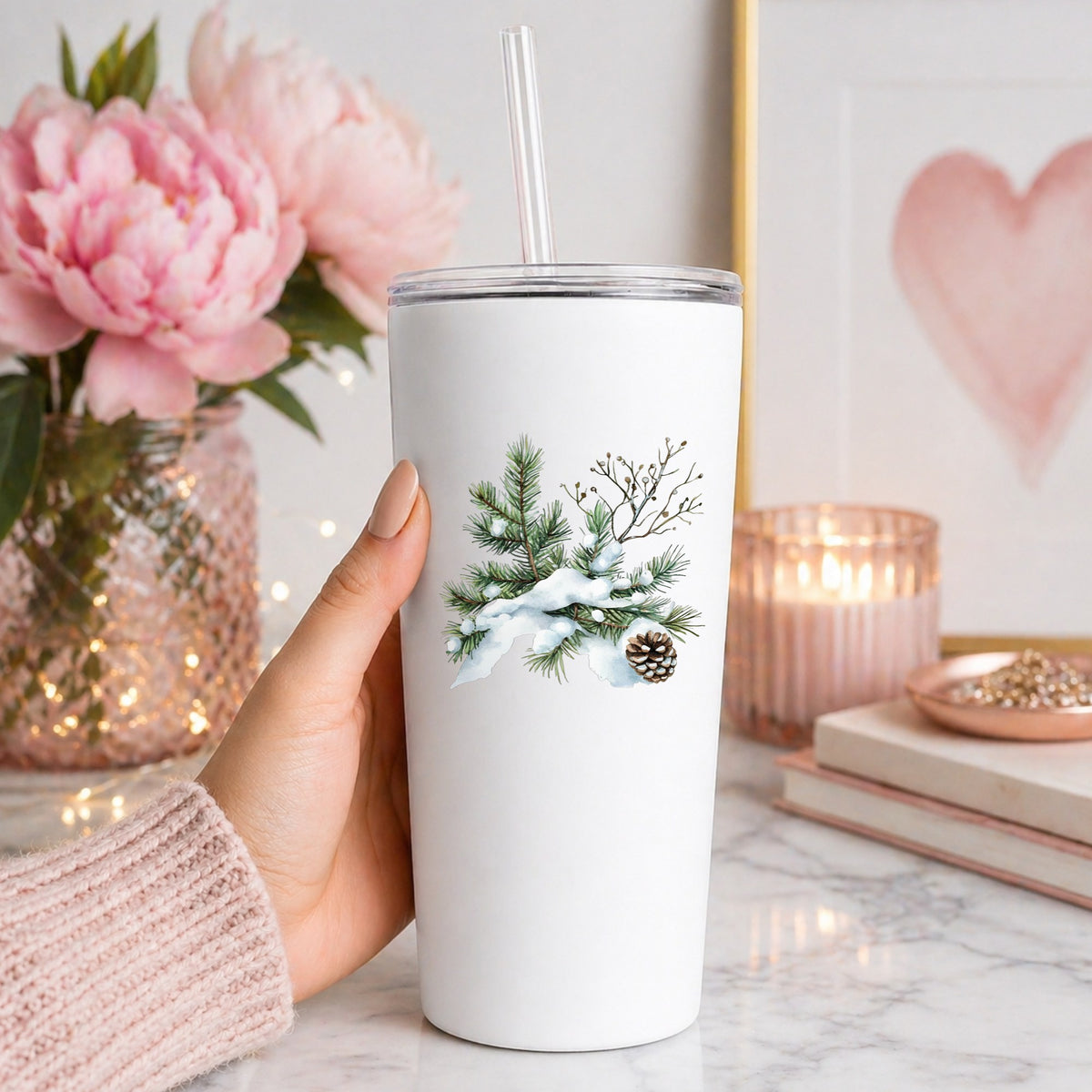 Snowy Pine Branch With Pine Cone UV DTF sticker applied to a white tumbler