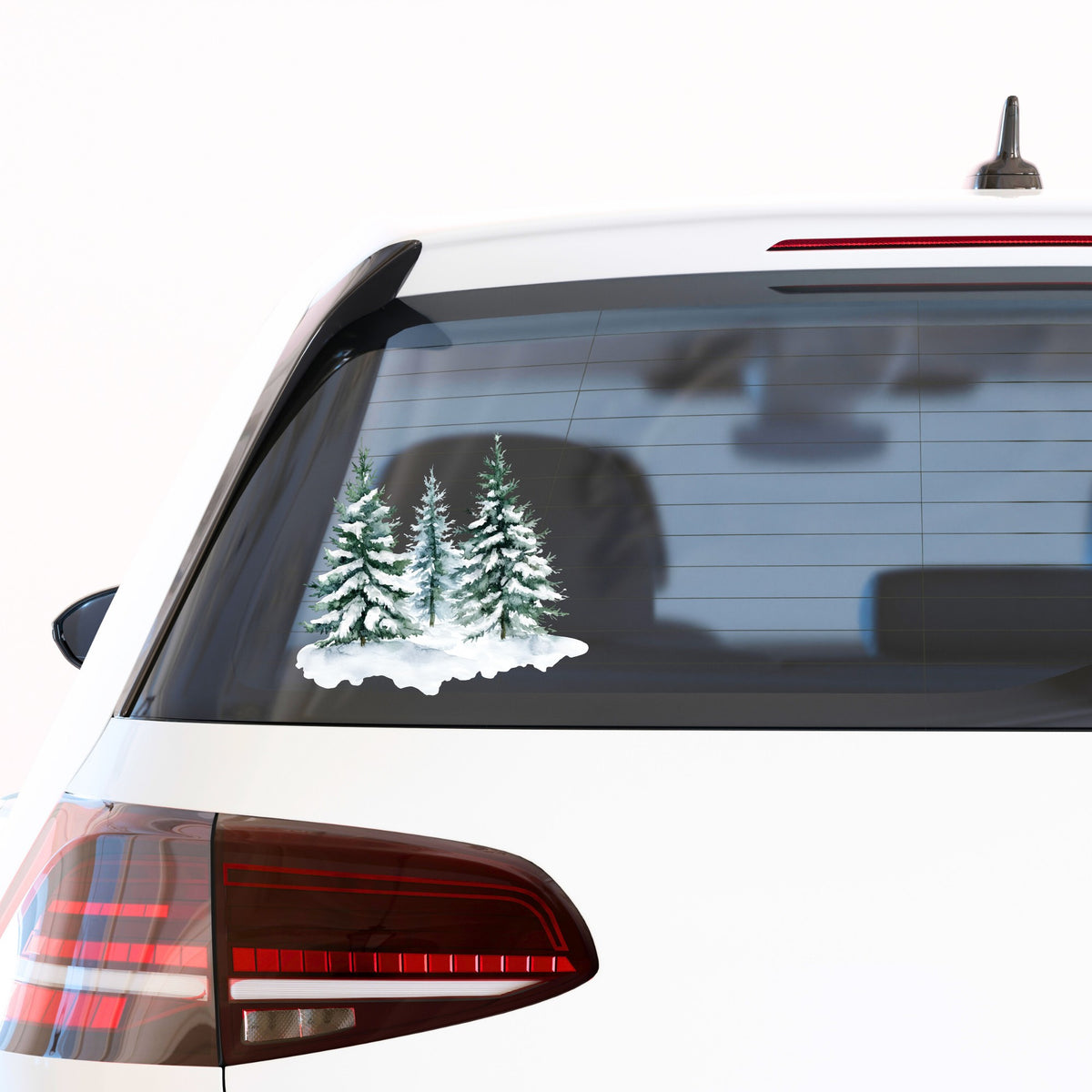 Three Snowy Pine Trees UV DTF sticker applied to a car window