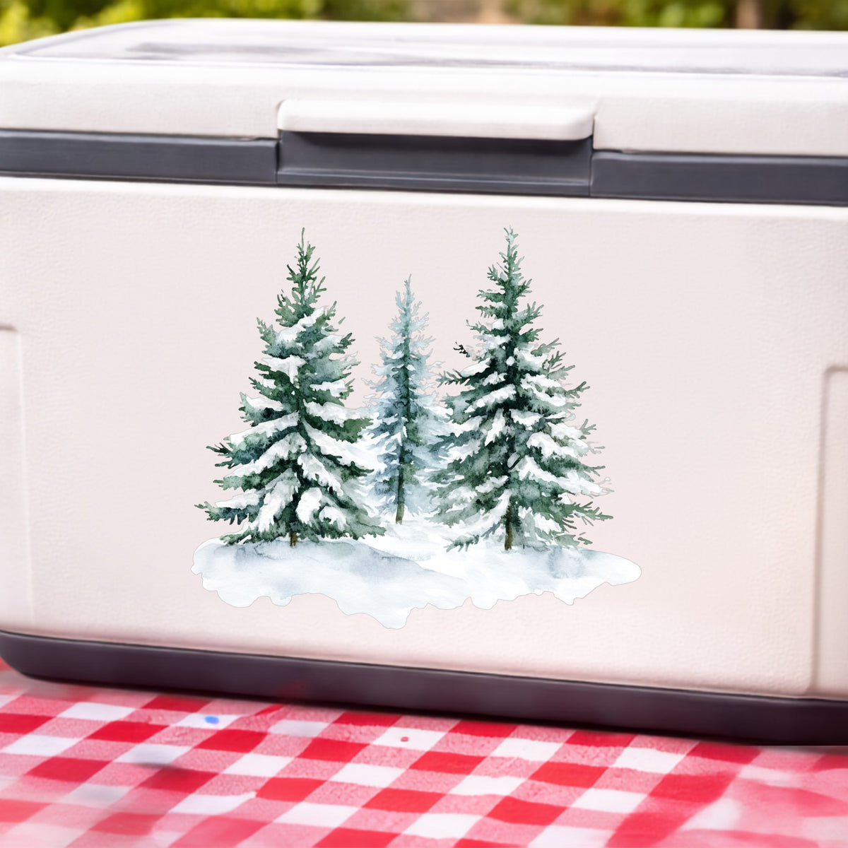 Three Snowy Pine Trees UV DTF sticker applied to a white cooler