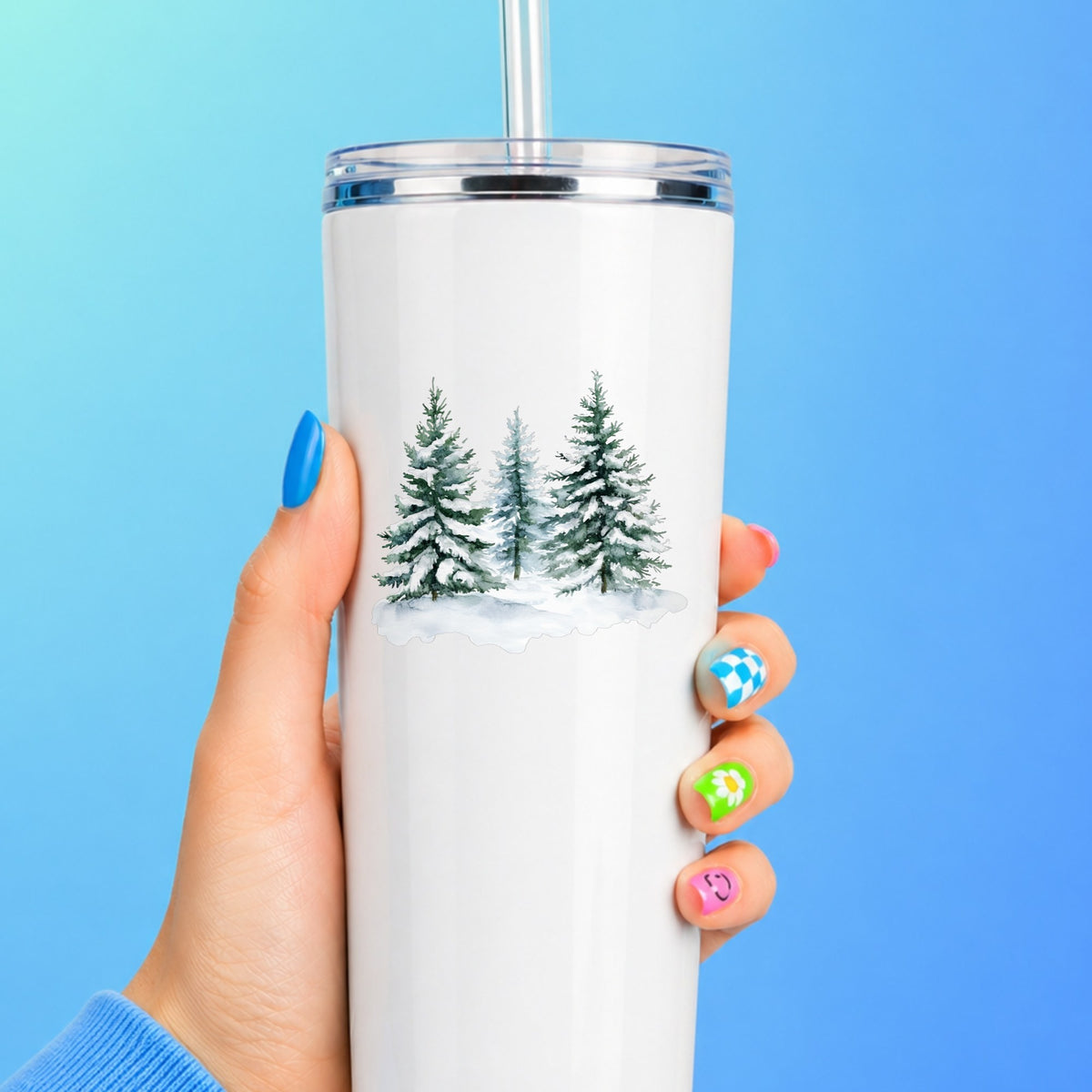 Three Snowy Pine Trees UV DTF sticker applied to a white tumbler