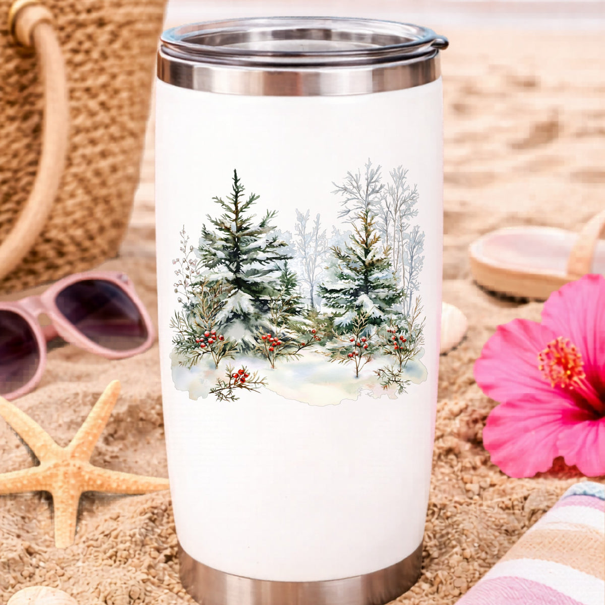 Winter Pine Trees With Berries UV DTF sticker applied to a water bottle at the beach