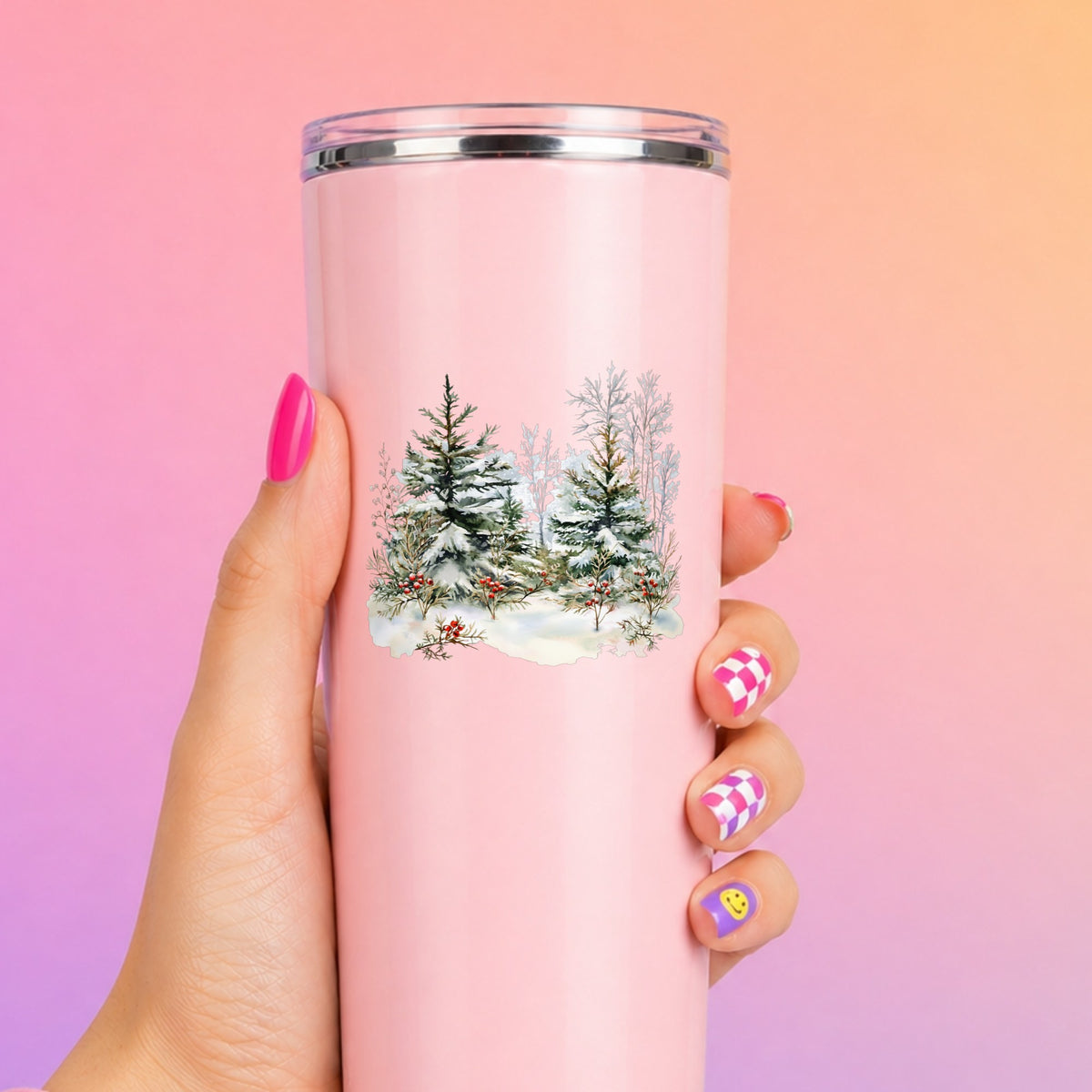 Winter Pine Trees With Berries UV DTF sticker applied to a pink tumbler