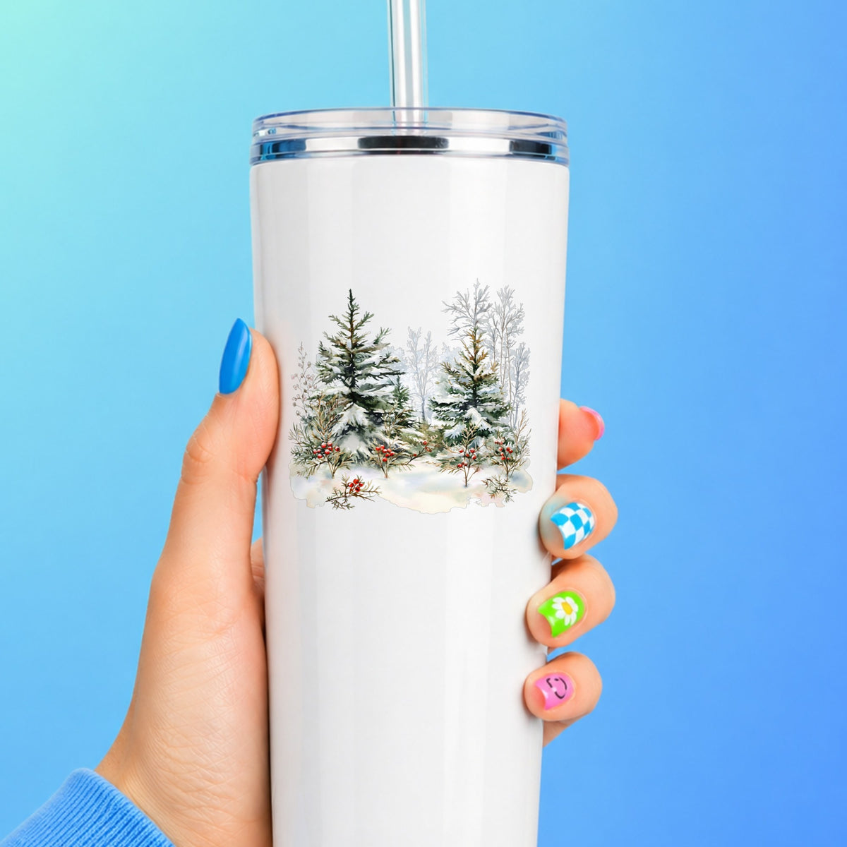 Winter Pine Trees With Berries UV DTF sticker applied to a white tumbler