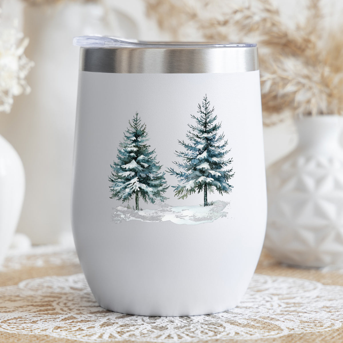 Snowy Evergreen Pair UV DTF sticker applied to a stemless wine glass