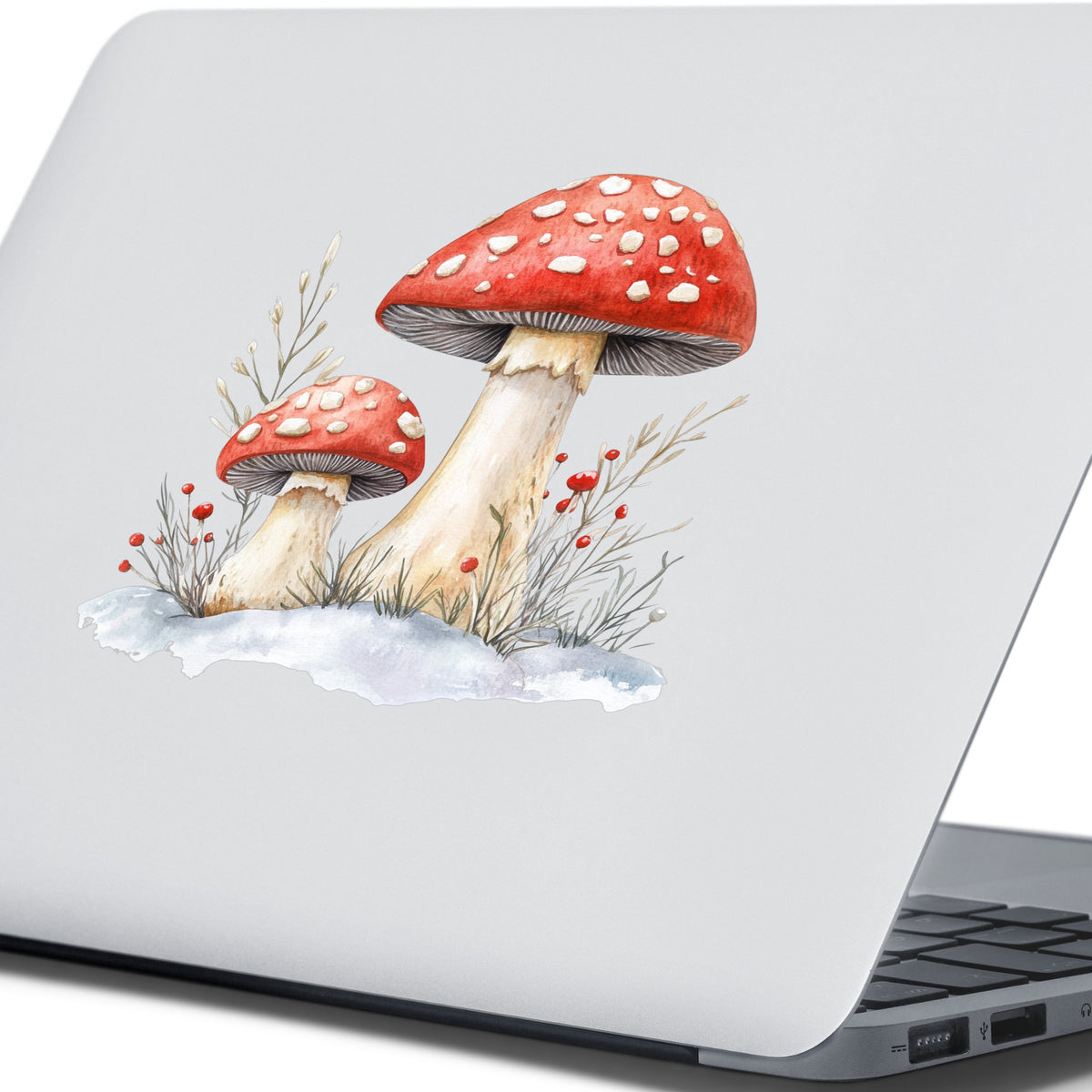 Red Mushrooms In Snow UV DTF sticker applied to a laptop